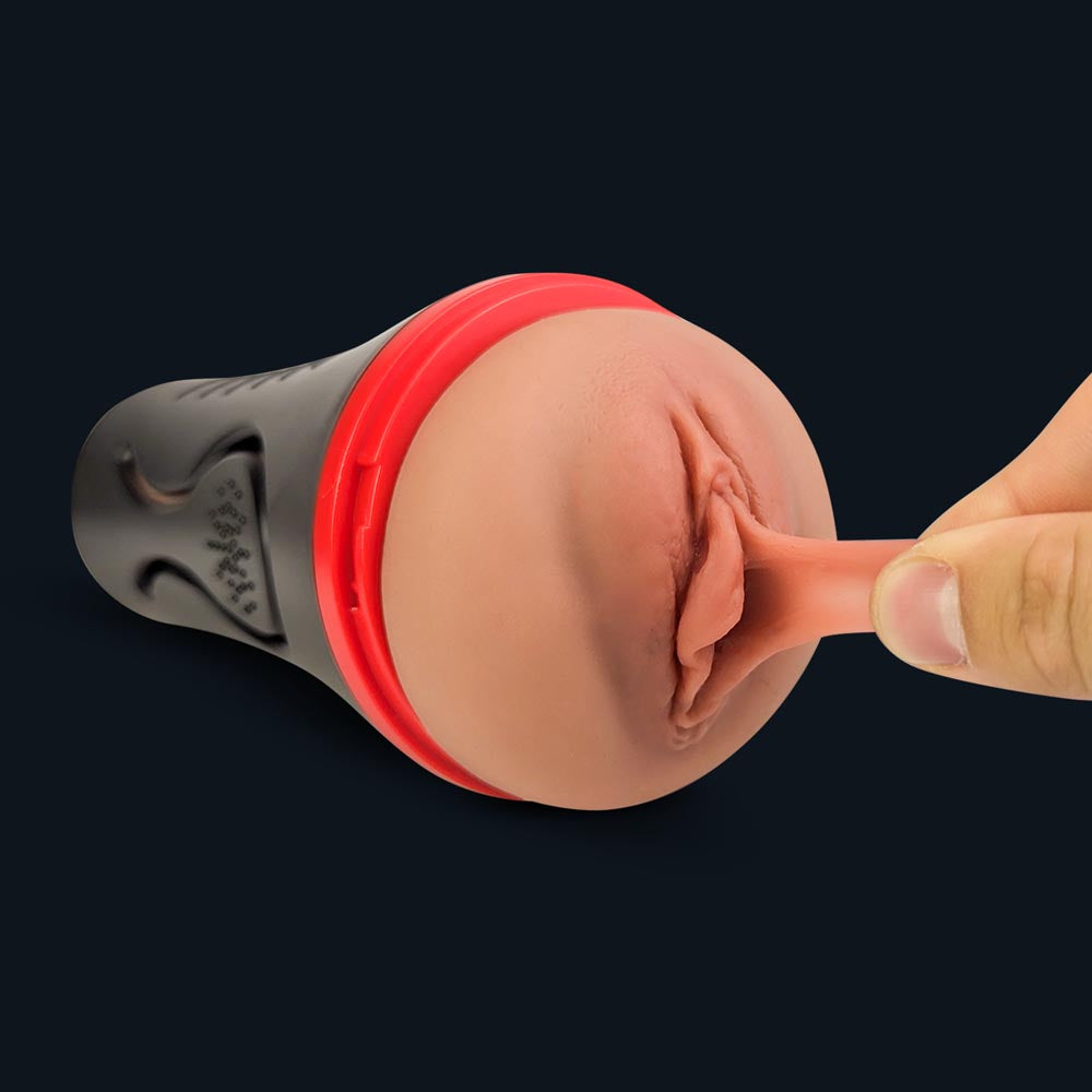 Finger stretching the soft labia of Lindsey's vaginal opening